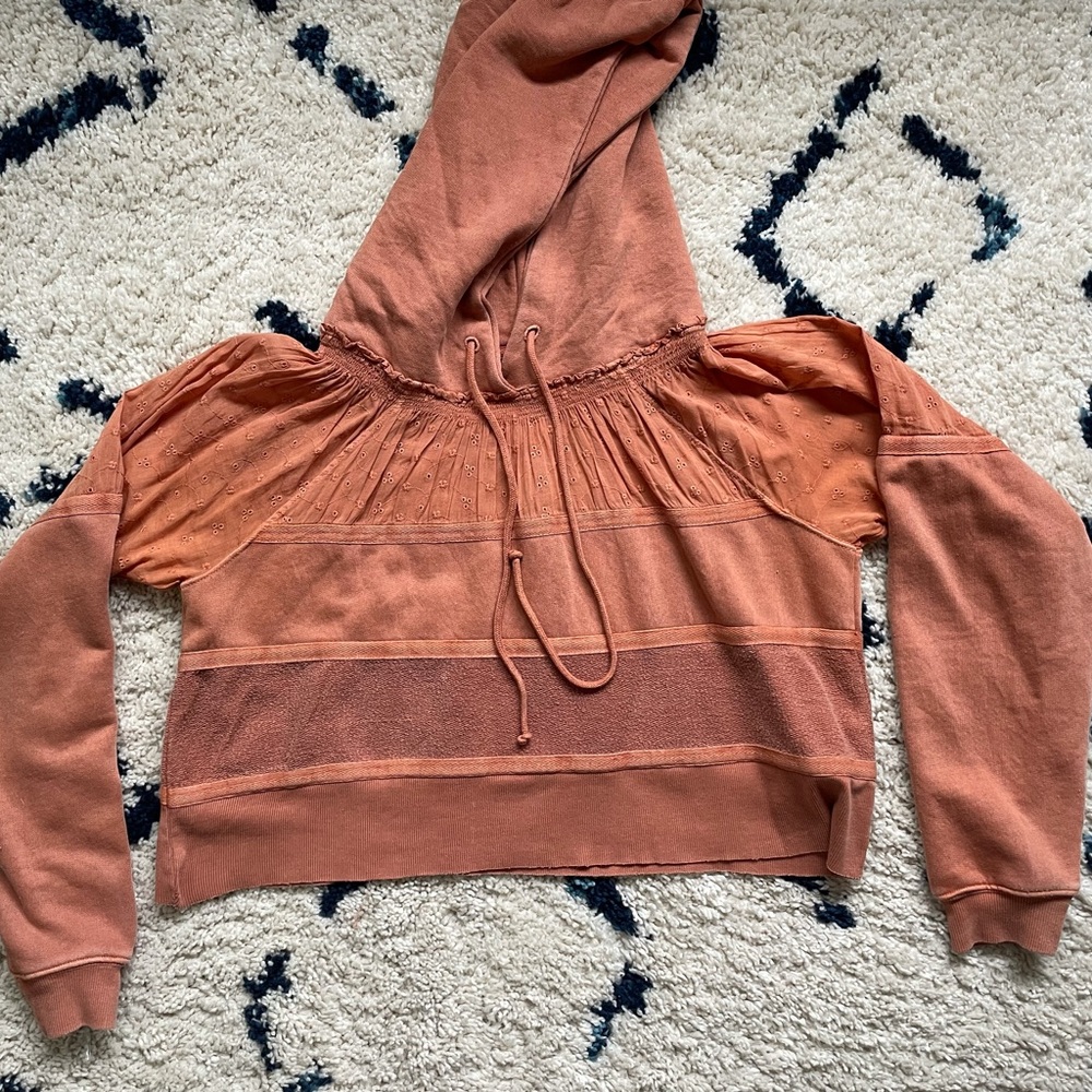 Free people distressed orange pullover. Super cute worn a few times.